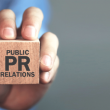 Man-holding-wooden-cube-with-the-word-public-relations