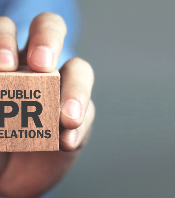 Man-holding-wooden-cube-with-the-word-public-relations